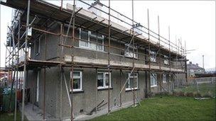 Homes with scaffolding outside