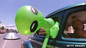 Alien head sticking out of car window (getty)