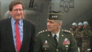 Richard Holbrooke (left) is escorted by US Gen Wesley Clark after arriving at Sarajevo airport, 29 September 1995