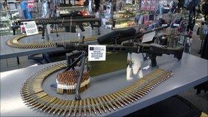 An automatic gun sitting on a table at a store