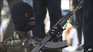 A soldier stands guard during a youth rally in Abidjan (18 December)