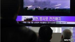 South Koreans watch news reports of drills in Seoul, 20/12