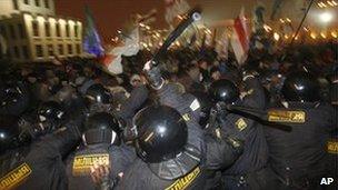 Riot police clash with demonstrators trying to storm the government building in the Belarusian capital, Minsk