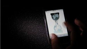 Wikileaks website is pictured on a smartphone