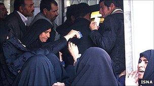 People queuing at a Tehran bank to receive payments promised under the new Subsidy Smart Plan
