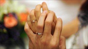 Newly-weds show off their wedding rings in Malaysia