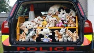 Toys in boot of police car