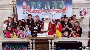 Santa Claus with Norad employees at the New York Stock Exchange