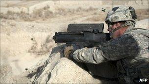 US soldier test fires in the Zheri district of Kandahar province on 22 December 2010