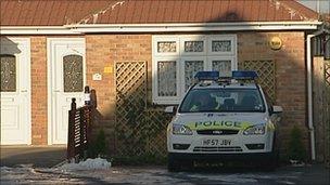 Police car outside house