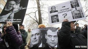 People attend a rally in support of Mikhail Khodorkovsky in front of the court building in Moscow