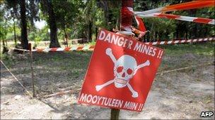 A sign warns villagers of a minefield in the southern Senegalese province of Casamance, 2009