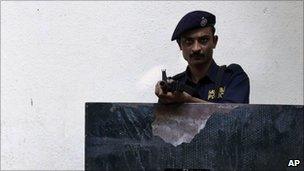 An Indian policeman stands guard outside a government office in Mumbai