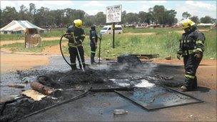 Firefighters put out fires in Bapsfontein (Tshepo Lesole/Eyewitness News)