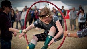 Girl jumps through hoop at Y-Not festival