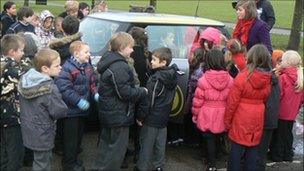 Pupils from Preston School, Stockton-on-Tees looking at the car