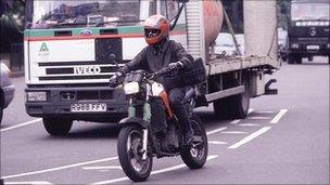 Motor bike in traffic, BBC