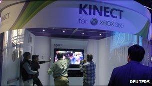 A Microsoft booth featuring the Kinect controller
