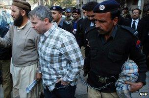 Pakistani police escort US national Raymond Davis (centre) to a court in Lahore on 28 January 2011