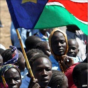 A Sudanese young man waves the regional flag of southern Sudan (image from 15/1/11)