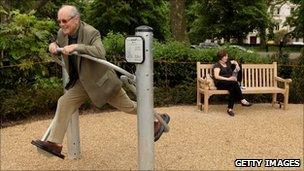 Pensioner in a playground for the elderly