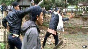 video grab made available 7 Feb by Human Rights Watch shows villagers attacking members of minority Ahmadiyah Islamic sect in Pandeglang, Banten province, on February 6, 2011