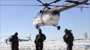 Romanian special police units send detained border officials away by helicopter. 8 Feb 2011