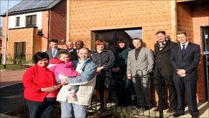 New tenants and council officials at the opening of the new homes