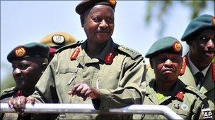 Uganda's President, General Yoweri Kaguta Museveni smiles as he inspects a guard of honour at Soroti, Uganda, Sunday 6 February 2011