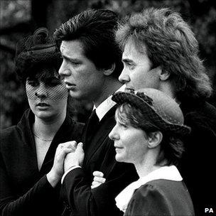 Jeremy Bamber, pictured second left, at a funeral following the Essex farmhouse killings. His then girlfriend Julie Mugford is pictured far left.