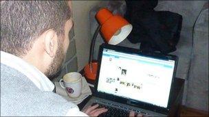 Man accessing Facebook site