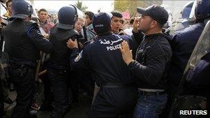 Algerian riot police push back anti-government protesters in Algiers - 12 February 2011