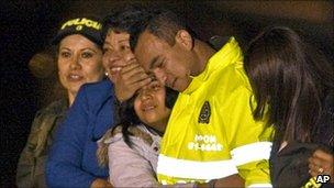 Carlos Ocampo hugs his family at Catama airbase in Bogota