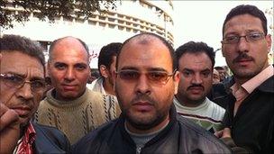 Ahmed Saad (centre) and other protesters outside the state TV in Cairo