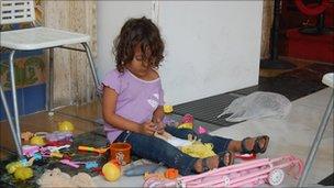 Child playing with her toys at the Venezuelan foreign ministry