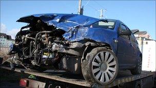 smashed car belong to Rachel McClean and Ryan Jones after it was hit by a train