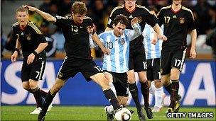 Messi (stripes) in action for Argentina against Germany in the 2010 World Cup