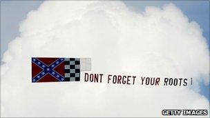 A flag is trailed behind a plane in Darlington, South Carolina, 2007