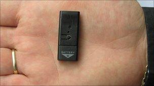 Small listening device in the palm of a hand