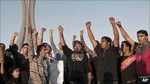 Bahrainis shout slogans in Pearl Square, the capital Manama, on Tuesday