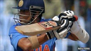 India's Sachin Tendulkar plays a shot during a Cricket World Cup warm-up match against New Zealand