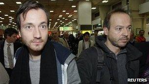 German journalists Jens Koch (left) and Marcus Hellwig arrive at Tehran's Mehrabad airport, 19 February
