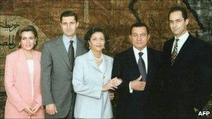 President Hosni Mubarak (2nd right) and his wife Suzanne(centre) pose for a family picture with their two sons Gamal (right) and Alaa (2nd left) and the latter's wife Heidi al-Sakher (left). File photo