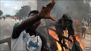 Supporters of Alassane Ouattara burn objects during a demonstration in the Abobo neighbourhood in Abidjan (February 2011)