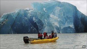A group of people travel with Glacier Explorers to see one of the many icebergs that caved into Tasman Lake 22 Feb 2011