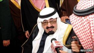 Saudi Arabia's King Abdullah speaks to Saudi media upon his arrival at Riyadh airport, 23 February 2011