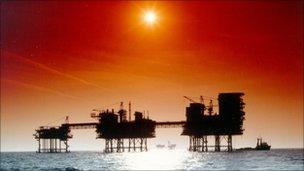 Oil rigs in silhouette