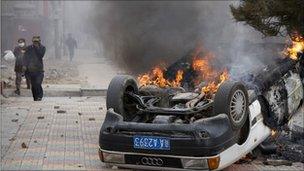 A burning car in Lhasa in March 2008