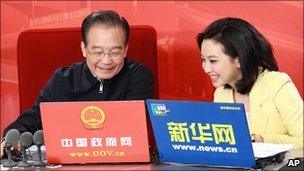 Xinhua photo of Wen Jiabao, left, preparing to hold online chat in Beijing, 27 February 2011