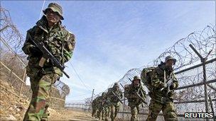 South Korean marines march during military training in Gimpo, west of Seoul, 25 February 2011